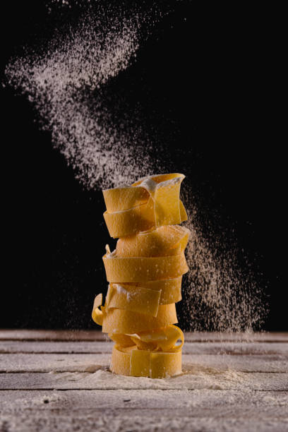 istock Dry pasta on a floured wooden surface 1320218986