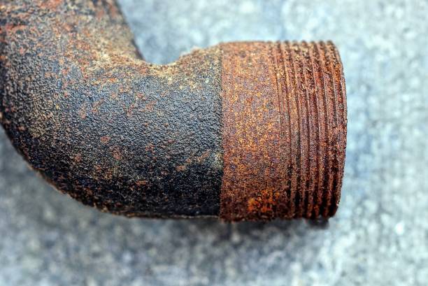 istock part of old brown iron pipe in rust with carvings 1320219122
