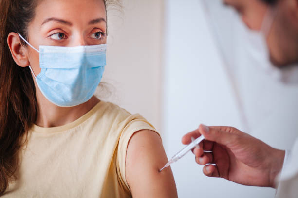 istock Young women receiving coronavirus vaccine 1320219190