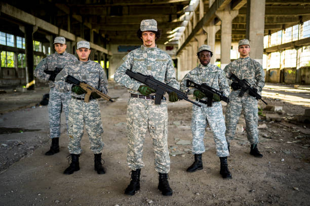 istock Soldiers with shotguns 1320219997