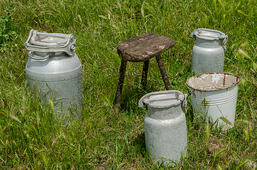 Antique aluminium milk containers