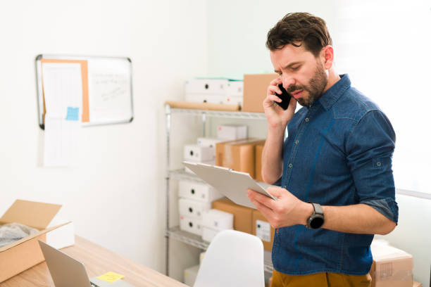 istock Good-looking man speaking to a customer 1320225376