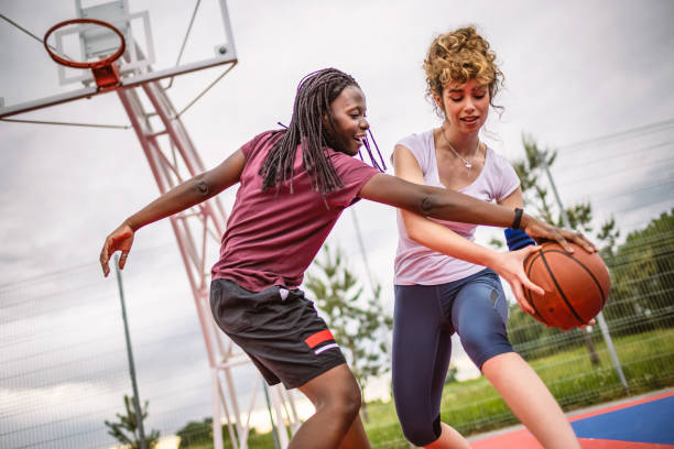 istock Girls playing basketball 1320226119