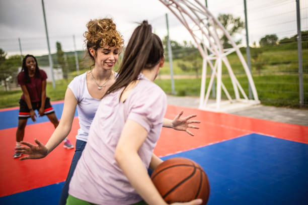 istock Girls playing basketball 1320226291