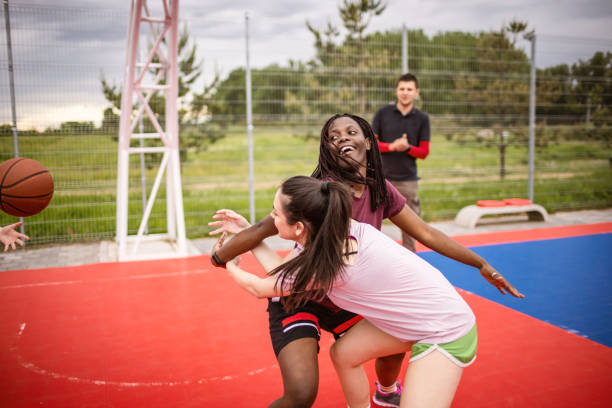 istock Girls playing basketball 1320228412