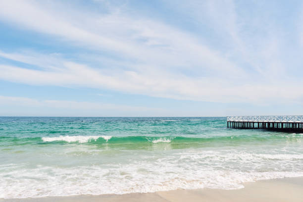 istock Seascape view with pier on the beach 1320229434