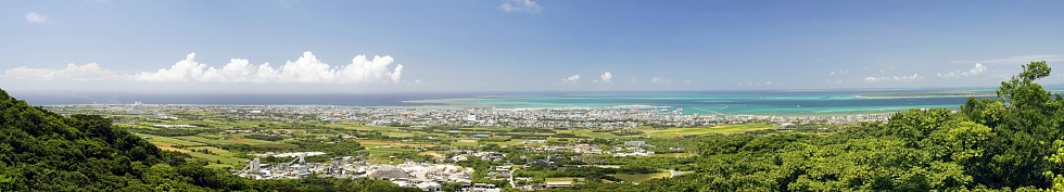 Okinawa,Japan - May 24, 2021: Panoramic view of Ishigaki City and Ishigaki port, Okinawa, Japan, from Banna park