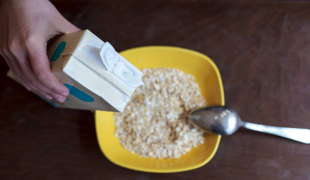 istock Pouring milk in a bowl for a breakfast 1320235880