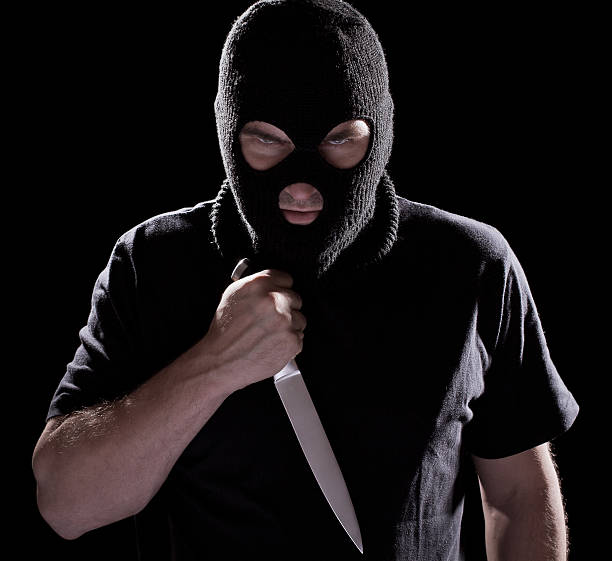 istock Burglar, man in mask holding knife 132023599
