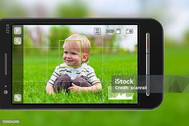 Taking Pictures Of Male Child On The Green Grass Stock Photo - Download Image Now - Boys, Camera - Photographic Equipment, Carrying