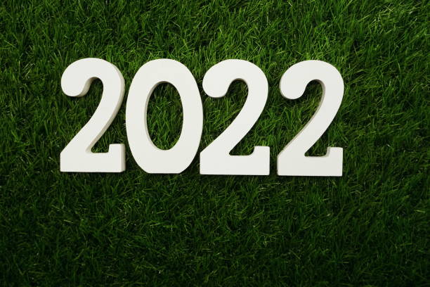 istock 2022 Happy New Year Flat lay on Green artificial grass 1320251771