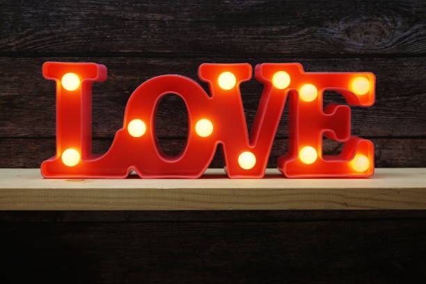 istock Pink Love LED Decorative on wooden background 1320253309
