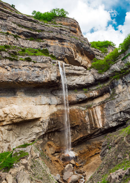 istock Beautiful high waterfall in the mountains 1320259139