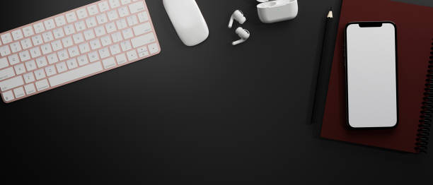 istock Top view of smartphone with mock-up screen on black table with computer device, 3D rendering 1320263455