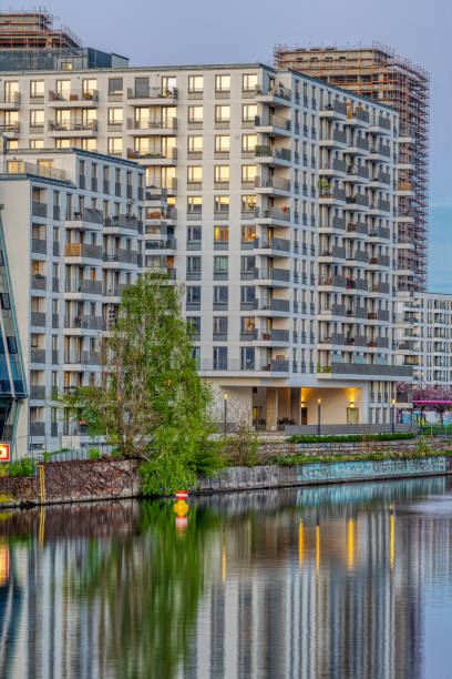 istock Big modern apartment building at the river Spree 1320264241