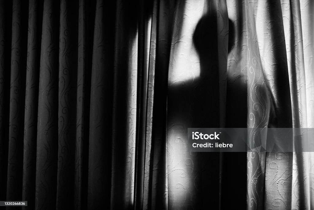Man behind a curtain back Shadow Stock Photo
