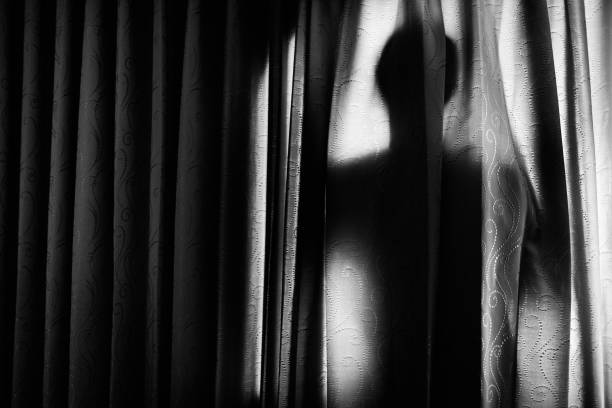 man behind a curtain back - shadow focus on shadow people men imagens e fotografias de stock