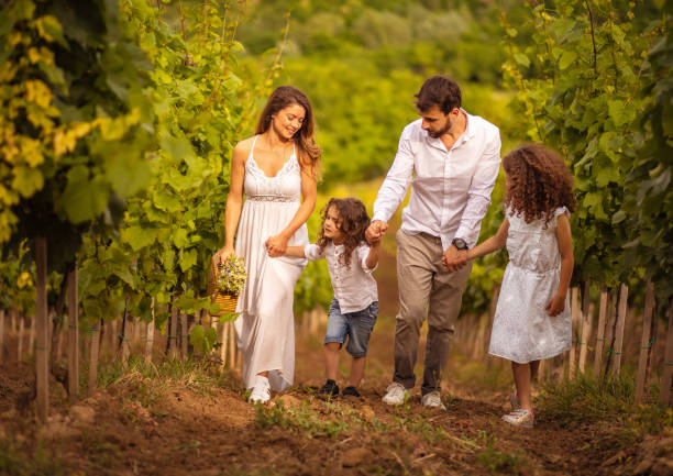 istock Family walking trough vineyard.  Time for walk. 1320266896
