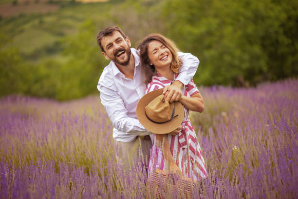 istock Young couple having fun on lavender field. 1320266969