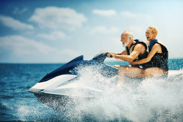 istock Senior couple jet skiing. 1320267778