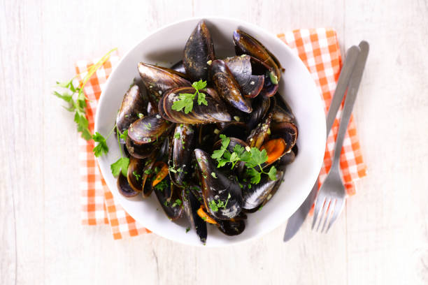 istock mussel with parsley in bowl 1320268393