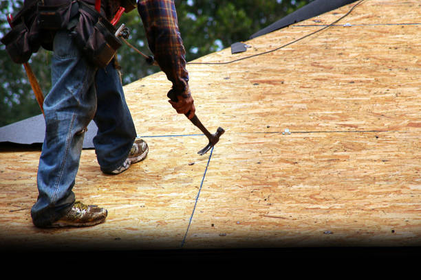 istock Roofer Removing Old Nails from Roof Deck 1320269396