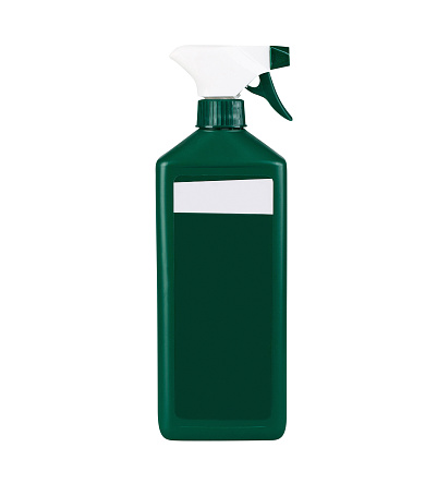 Green bottle of cleaning agent with blank label with sprayer, isolated on white