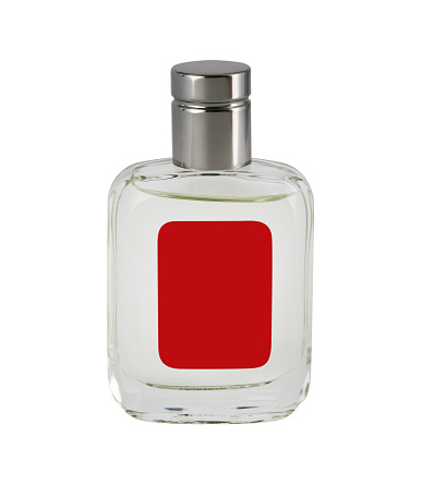 Transparent bottle of perfume with blank red label isolated on white, silver colored lid