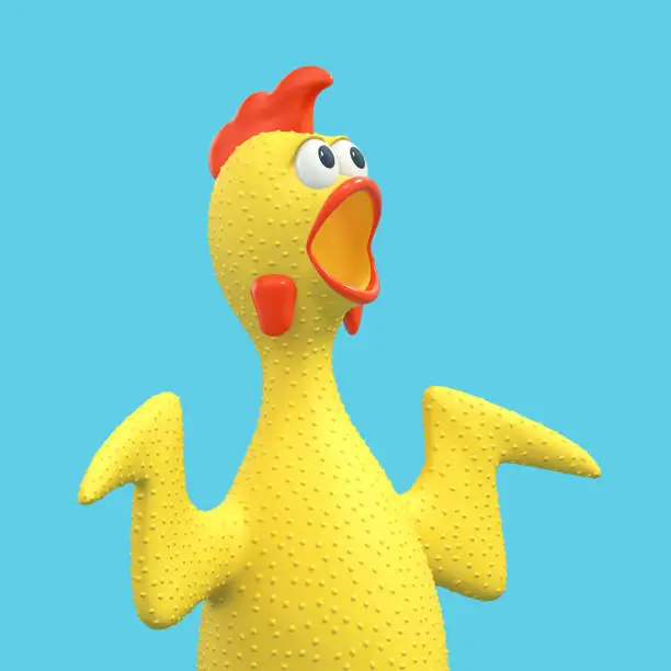 Photo of Screaming rubber chicken, surprised chicken, singing rooster isolated on blue