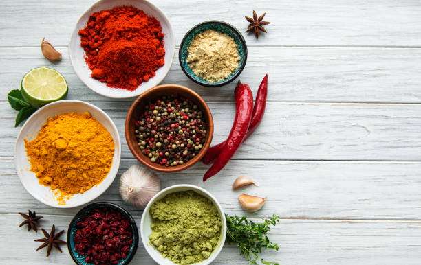 istock Various spices  on white wooden background, top view 1320270919