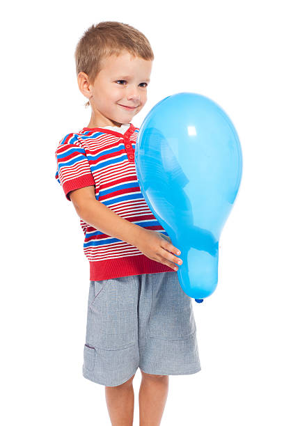 istock Smiling little boy holding the balloon 132027130