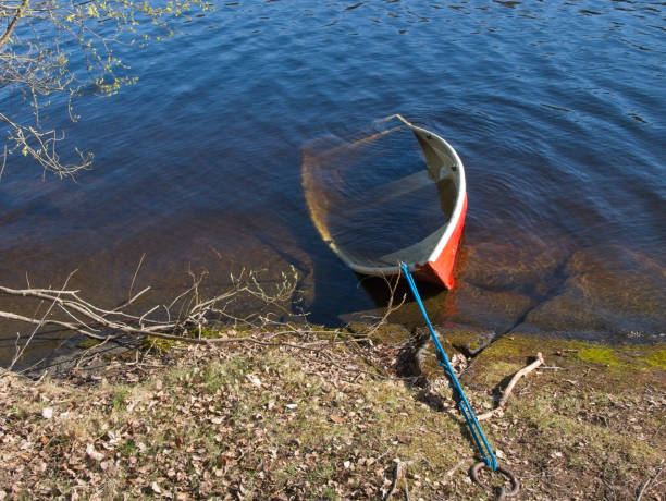 Sunken rowing boat on the shore