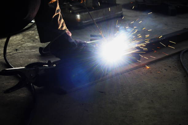 istock Welding spark iron, wearing light colored gloves like fireworks, industrial, welder. 1320272491