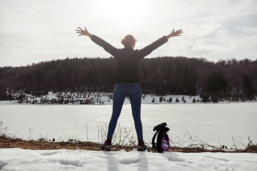 Woman enjoying on a mountain winter fresh air.