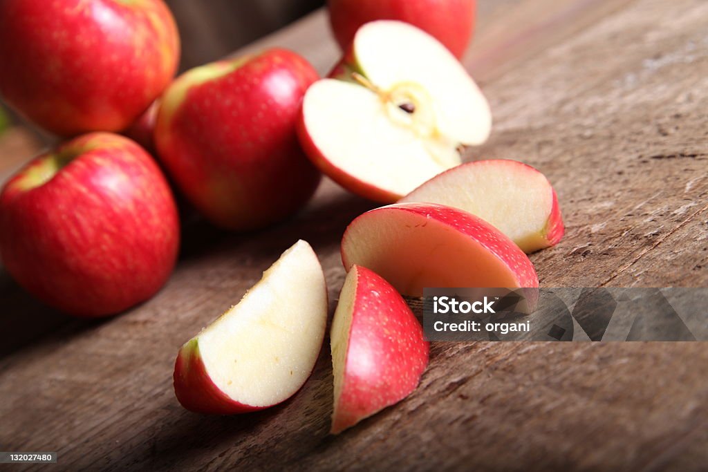 Red Apple Red Apple and slices on barn Wood  Apple - Fruit Stock Photo