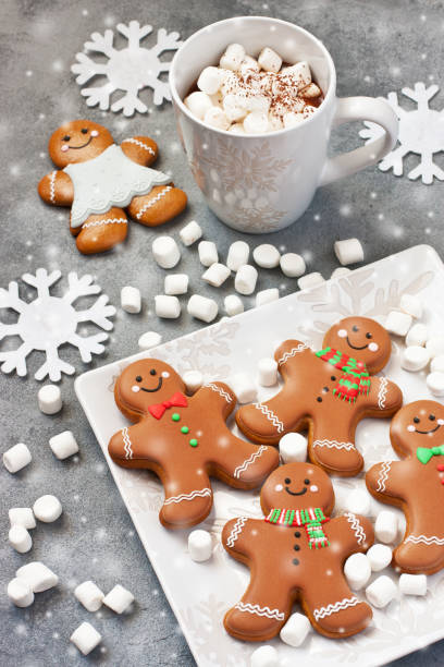 istock Cup of hot chocolate with marshmallows and   gingerbread cookies 1320279286