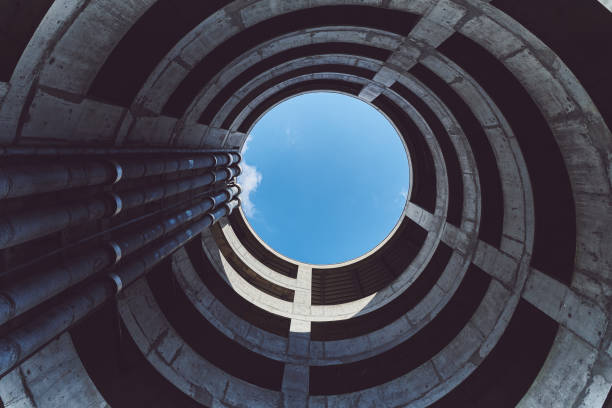 istock Low Angle View Of Spiral Building Against Blue Sky 1320283137