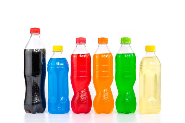 Multi colored drinks in plastic bottles Multi colored drinks in plastic bottles isolated on white background. soda bottle stock pictures, royalty-free photos & images