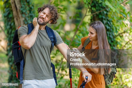 istock Man and his Wife are Scratching Itchy Skin due to the Attack of Insects in Nature. 1320285455