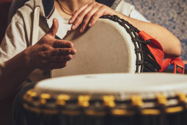istock The drummer plays the ethnic percussion musical instrument djembe 1320286977