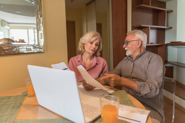 istock Active Seniors are Sitting at Home and Feeling Unpleasant Calculating Home Finances. 1320288092