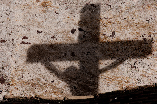 Shadow on the wall of Jesus on the cross