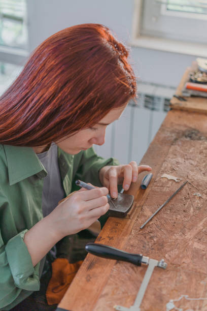 istock Woman making jewelry at her studio 1320289142