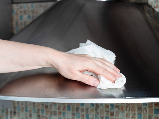 istock hand wipes stainless steel surface closeup 1320289298