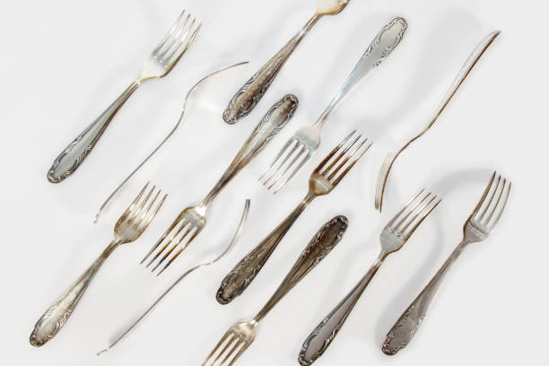 istock Old silver Vintage cutlery. Vintage forks isolated on a white background. 1320289426
