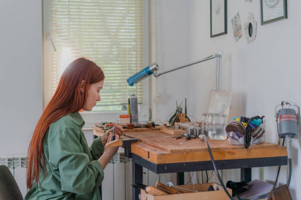 istock Woman making jewelry at her studio 1320289564