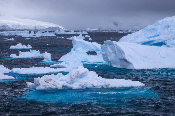 istock View of blue icebergs floating on Antarctic Ocean 1320292148