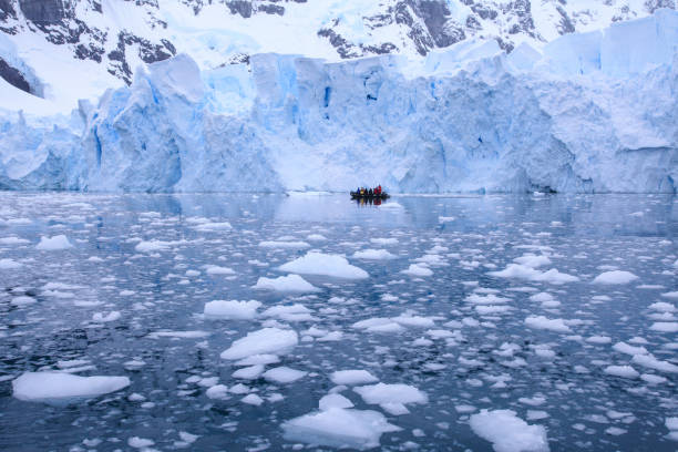 istock Tourists watching large glacier while passing through Paradise bay 1320292155