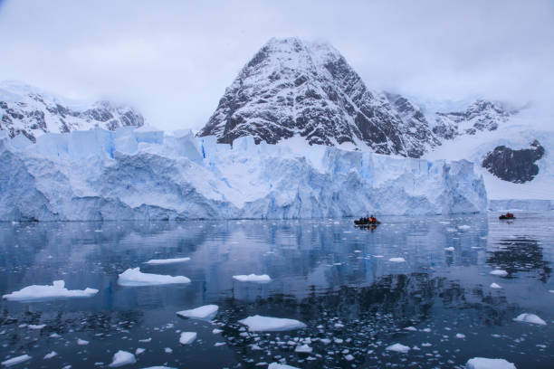 istock Tourists watching large glacier while passing through Paradise bay 1320292264