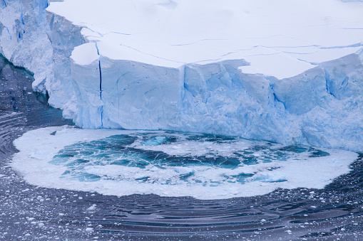High angle view of glacier collapsing on Antarctic Ocean, Neko Harbor, Antarctica.